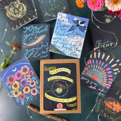 Collection of colorful cards with various designs on a textured surface.
