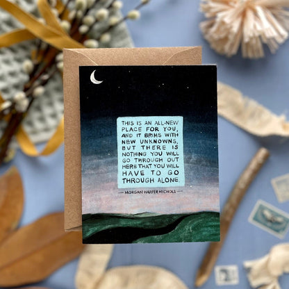 Greeting card with a quote on a night sky background, surrounded by decorative elements.